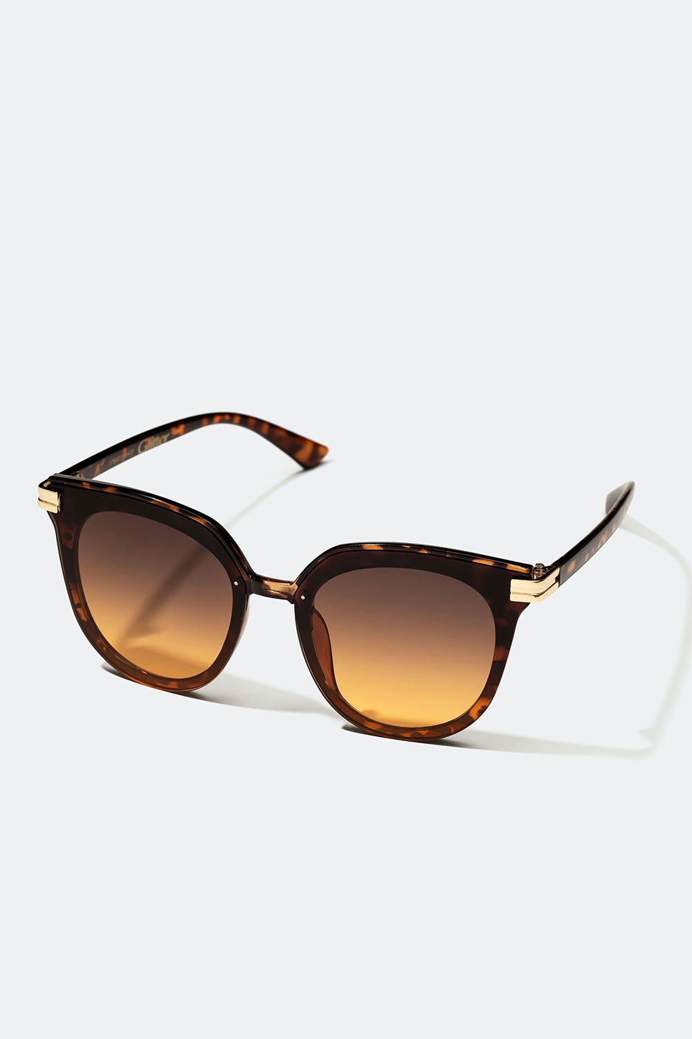 Brune solbriller i rund modell med gullfarget detalj i gruppen Accessories / Solbriller hos Glitter (176001118400)