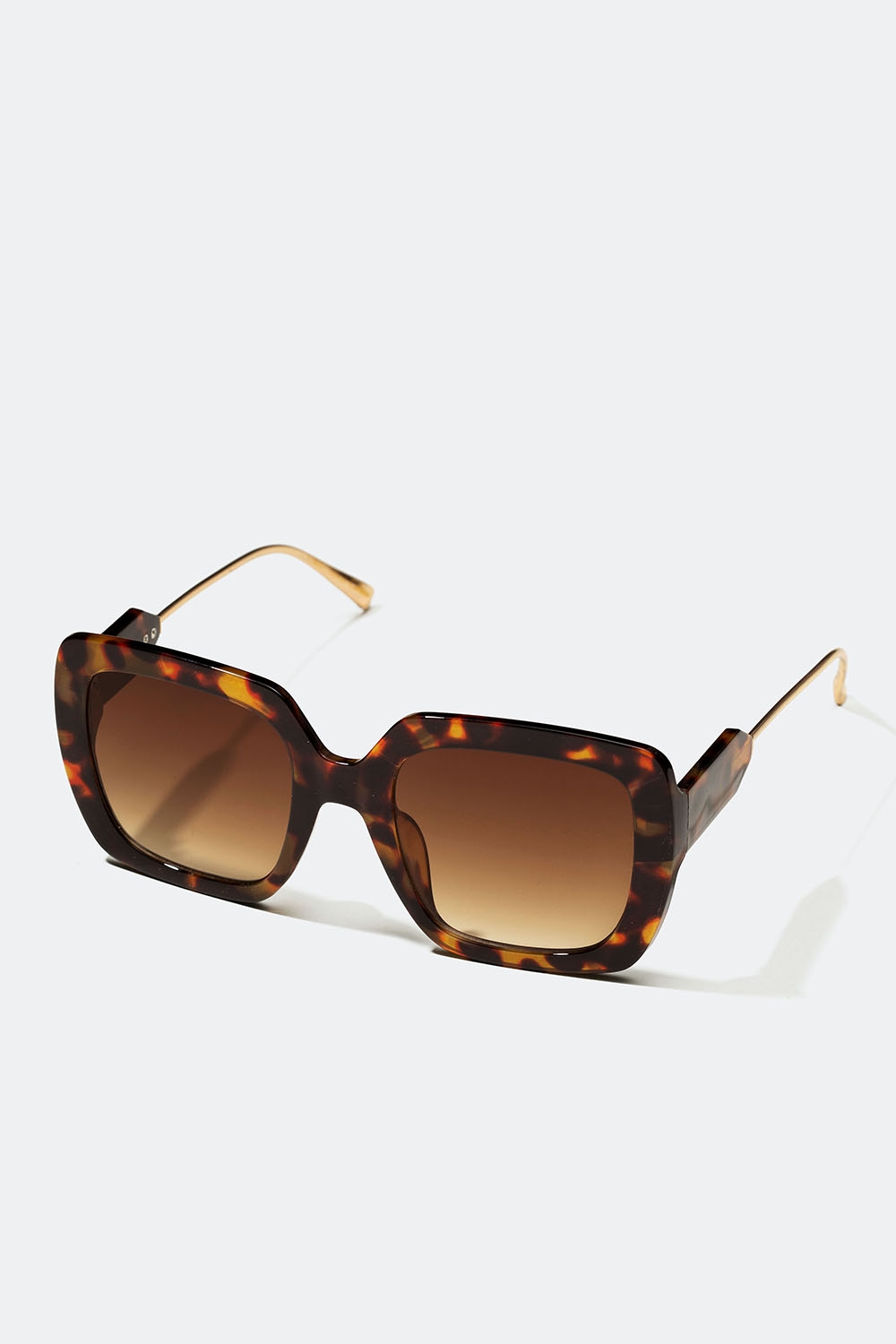 Brune oversize-solbriller med gullfargede brillestenger i gruppen Accessories / Solbriller hos Glitter (176001158400)