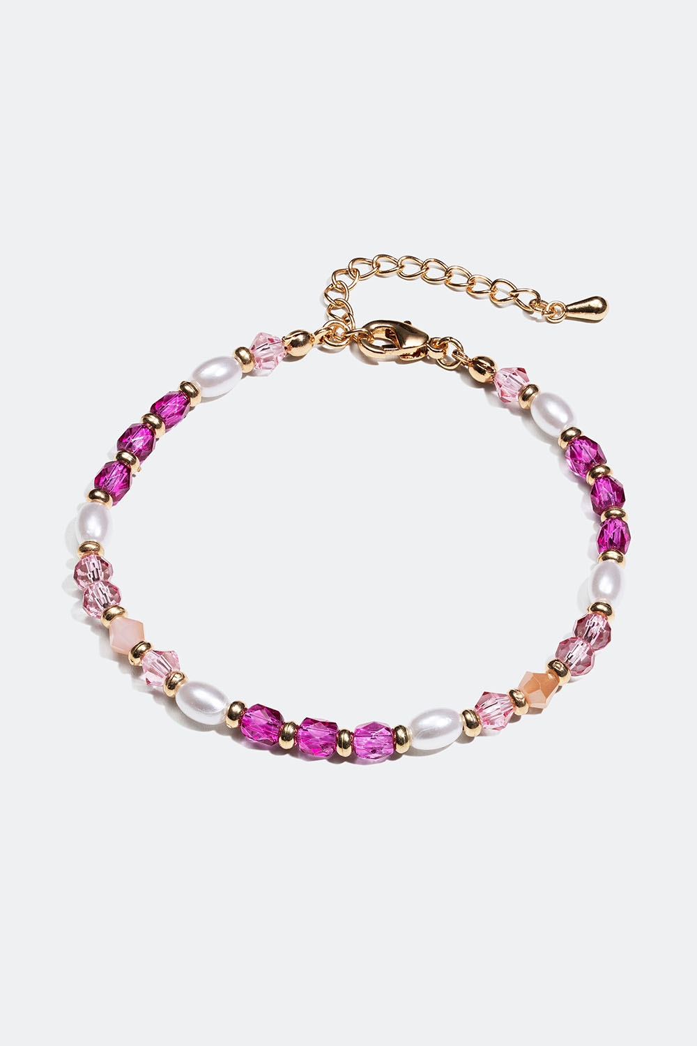 Armbånd i gullfarget metall med rosa perler i gruppen Smykker / Armbånd / Tynne hos Glitter (251000955402)