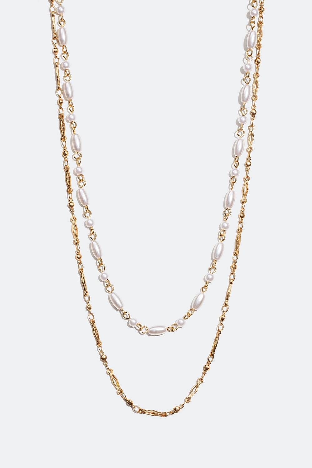 Gullfarget, dobbelt halskjede med ovale og runde perler i gruppen Smykker / Halskjeder hos Glitter (254001402002)
