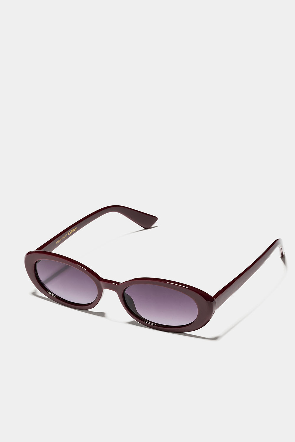 Ovale solbriller med burgunderrøde innfatninger