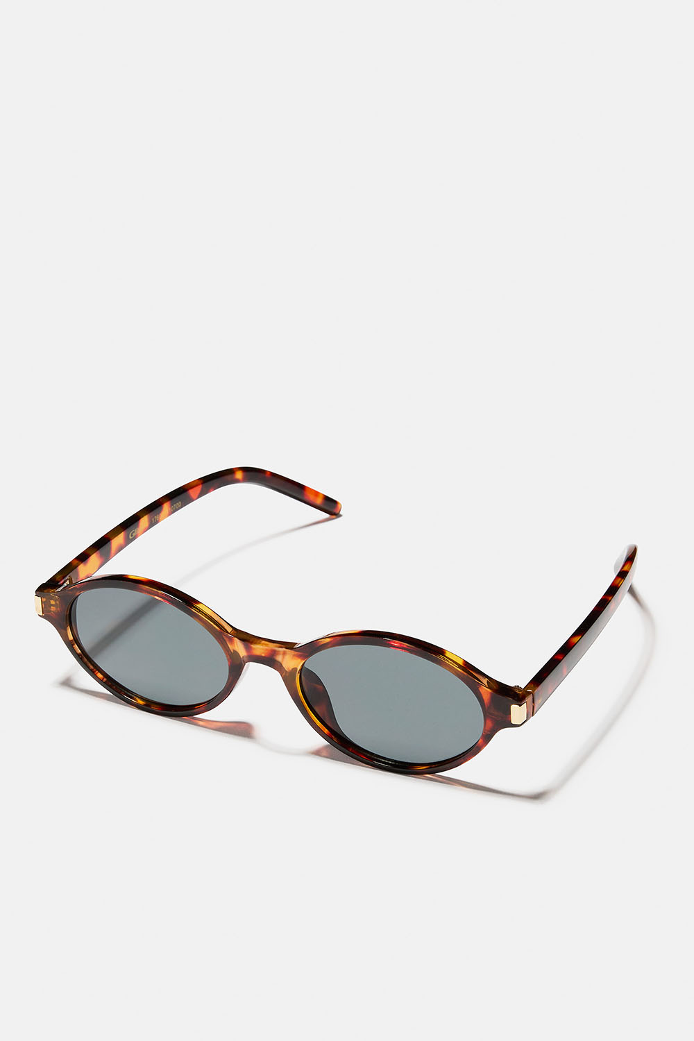 Brune, ovale solbriller med gullfargede detaljer