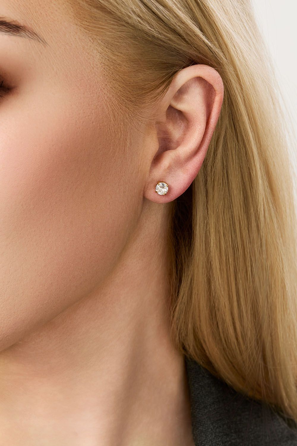 Stiftøredobber i stål med 18 karat gull og zirkonia