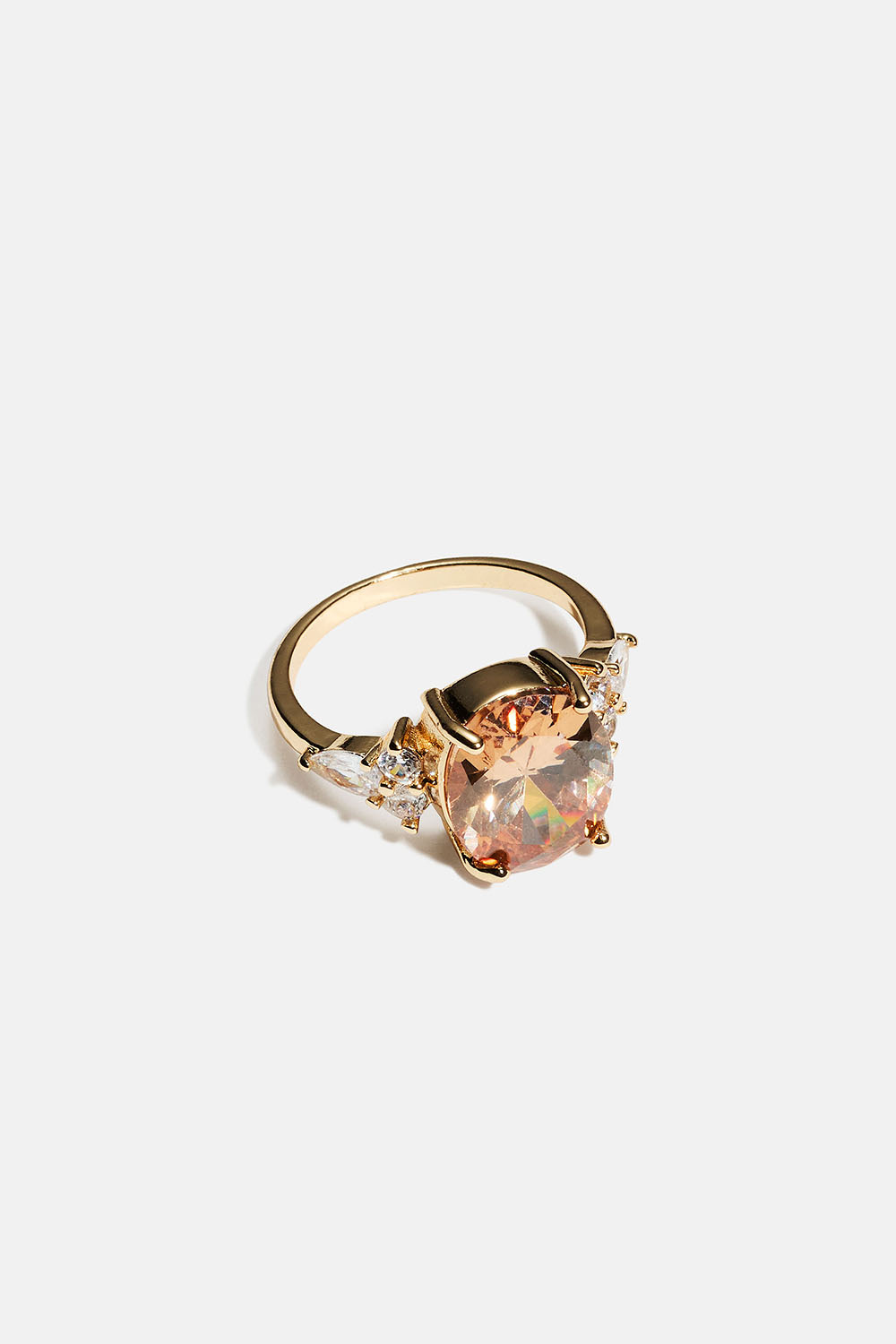 Gullfarget ring med stor oval glasstein